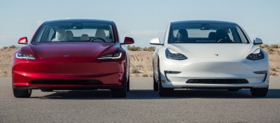 Два электромобиля Tesla, красный и белый, на дороге — CostaSpain.net Два электромобиля Tesla, красный и белый, на дороге